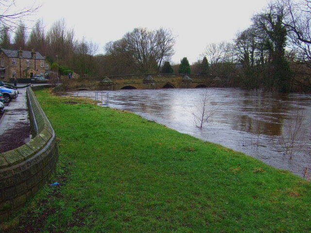 River Derwent The river in flood,if the water rises much higher,Darley Bridge will be flooded.