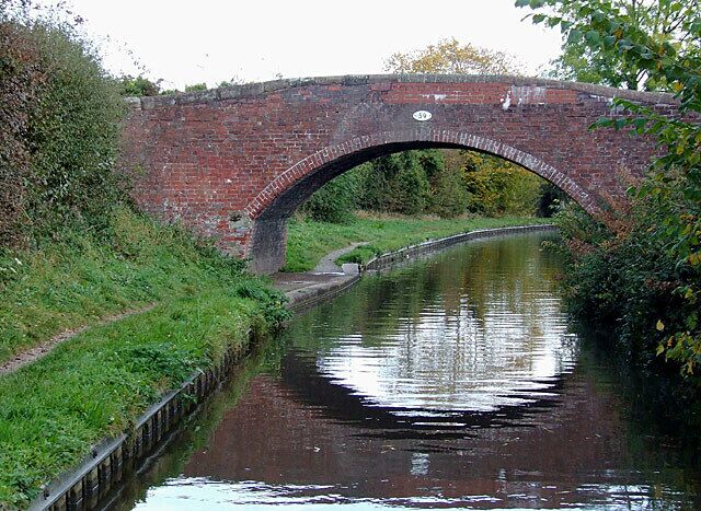 Bridge No 59 at Handsacre, Staffordshire. On the Trent and Mersey Canal, the bridge was formerly a farmer's access bridge, but now links the towpath with the housing estate at Old Road.