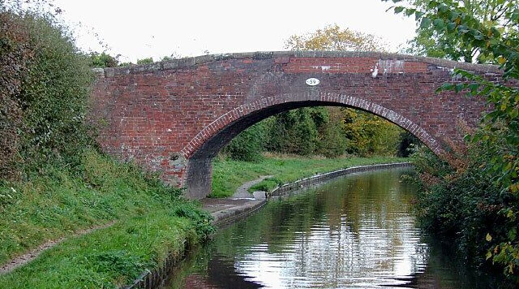 Bridge No 59 at Handsacre, Staffordshire. On the Trent and Mersey Canal, the bridge was formerly a farmer's access bridge, but now links the towpath with the housing estate at Old Road.