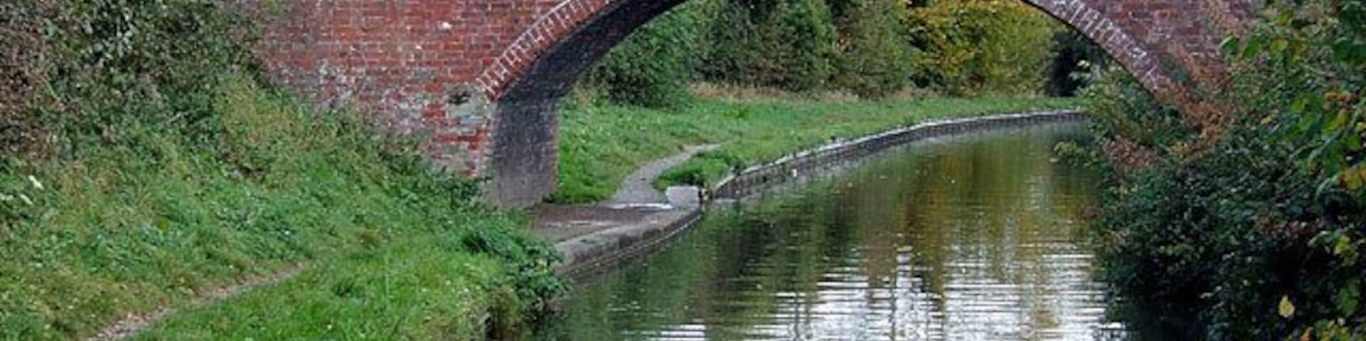 Bridge No 59 at Handsacre, Staffordshire. On the Trent and Mersey Canal, the bridge was formerly a farmer's access bridge, but now links the towpath with the housing estate at Old Road.