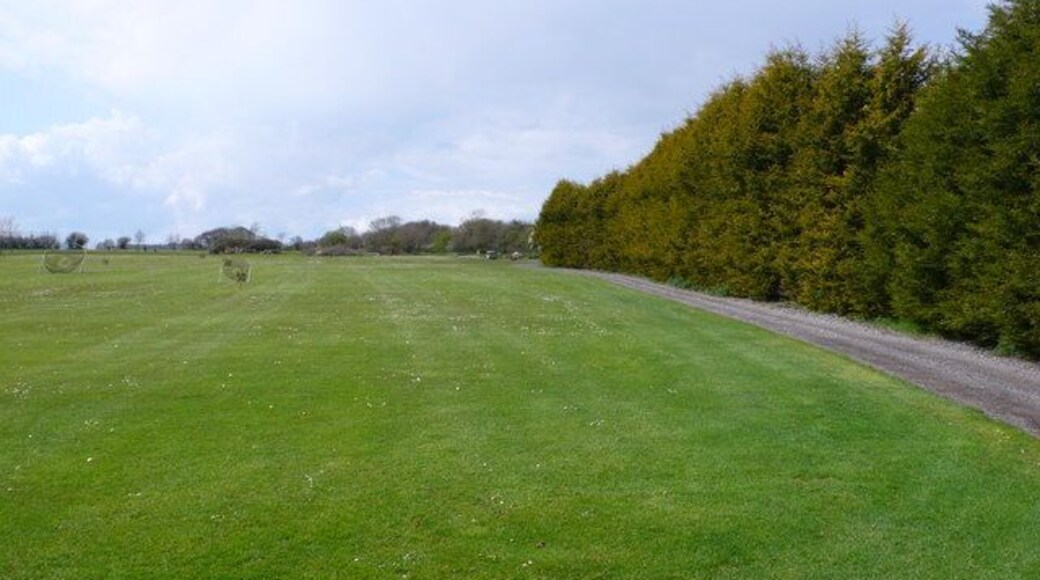 Folke Golf Club Driving Range The driving range is almost entirely in ST6614 while most of the rest of the club is in ST6613.This hedge forms the right hand (northern) boundary of the range. Only the extreme left (south) edge of the range is in ST6613. This is out of picture to the left. The NS grid line runs across the range just beyond the end of the hedge. The photographers position by GPS for this shot was ST6610614025 and everything in shot except the far distance is in ST6614