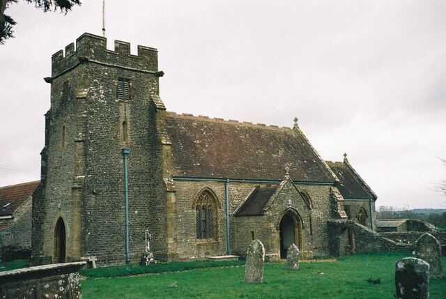 A historic church with a tower and arched windows.