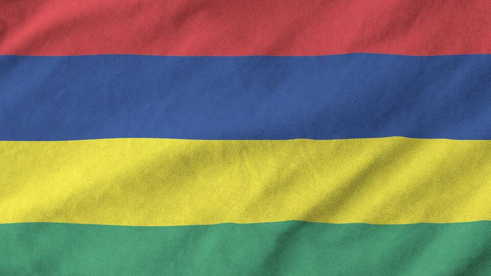 A flag with horizontal stripes of red, blue, yellow, and green.