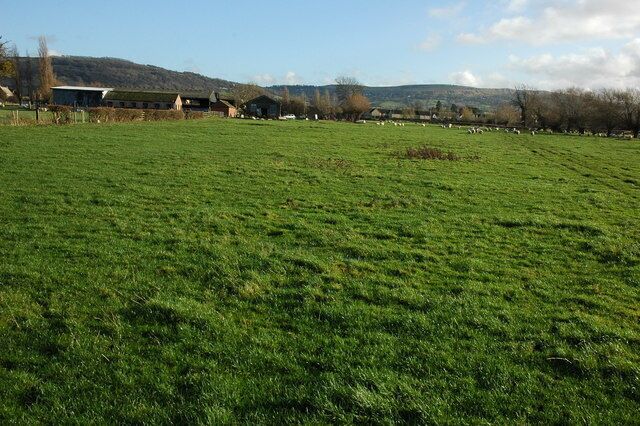 Dean Farm, Bishop's Cleeve Dean Farm, viewed here from a passing footpath is situated just beyond the sprawl of housing which has expanded the village. Modern houses can be seen in the background.
