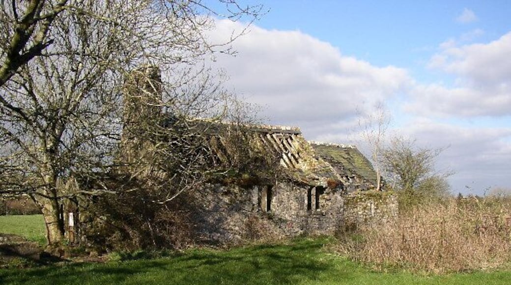 Mounton Chapel. St Michael's Chapel, originally the parish church, is derelict. It has a nave with a tall bellcote and a porch at the western end and a chancel, which was built at a different time. The porch has a reset 15C doorway and there is a piscina with a trefoiled head in the chancel. The nave has square mullioned windows and a king-post roof, part of the 19C restoration work. The church appears isolated now, but four old roads converge on it, and there may be a lost village nearby. There are several springs to the east.