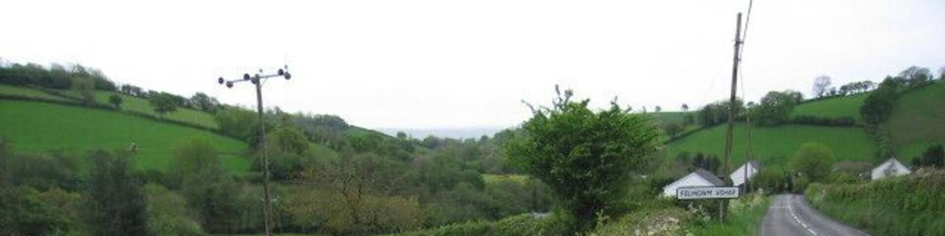Felingwm Uchaf This shows the fields below the road just above the little village of Felingwmuchaf (two words on the roadsign).