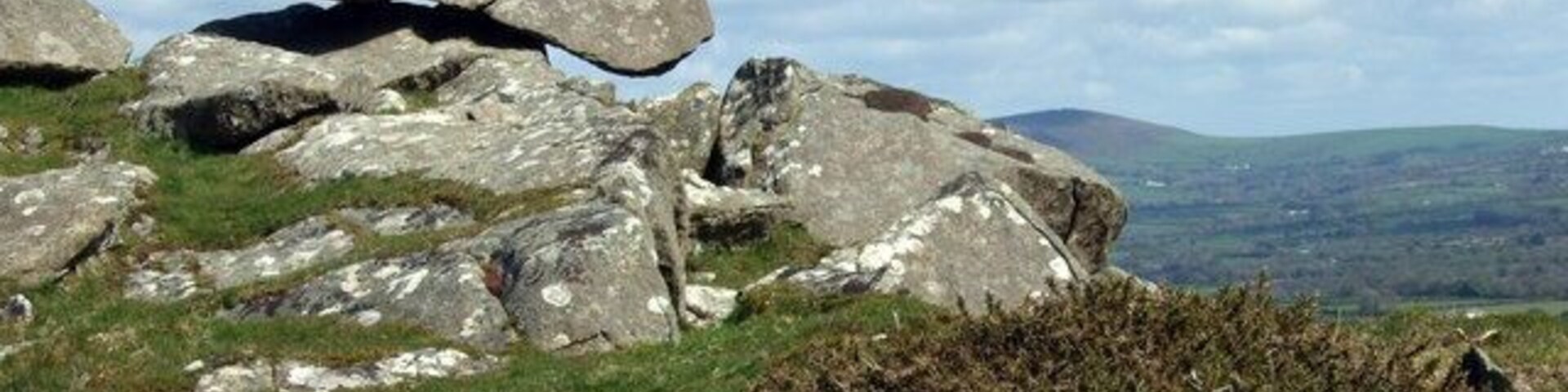 Balanced rock at Carnedd Meibion Owen It looks ready to roll but seems to be secure. The peak in the distance could be Frenni Fawr, almost due east.