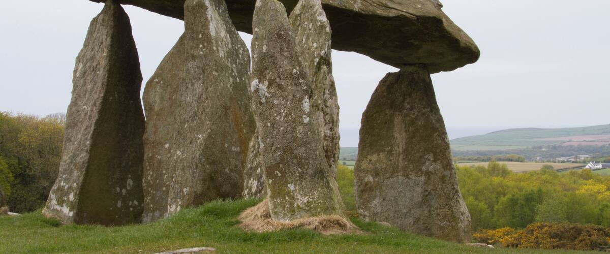 Stonehenge standing on a grassy hill.