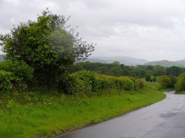 Country Lane, Llanfabon This twisty lane lined with grassy verges and hedgerows leads downhill from the Rhymney Valley Ridgeway to the village of Nelson.