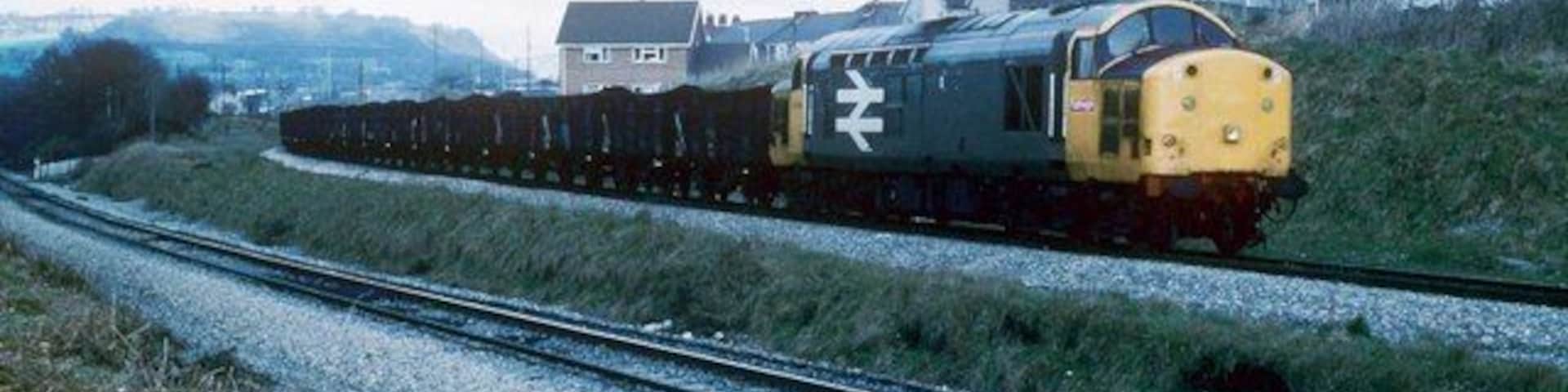 Coal from Cwm Bargoed Approaching the Junction at Nelson and Llancaiach this train has come to a stand. The line in the foreground once went to Deep Navigation Mine and Trelewis. This was a busy location with the movement of coal and shale. Nowadays only the line to Cwm Bargoed is left with infrequent trains.