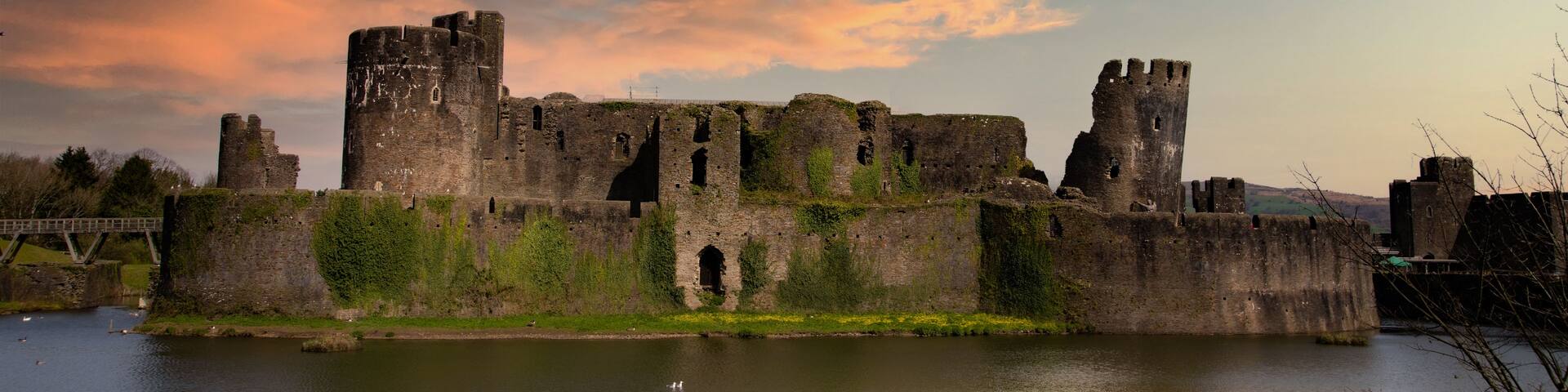 A historic castle with multiple towers and a moat.