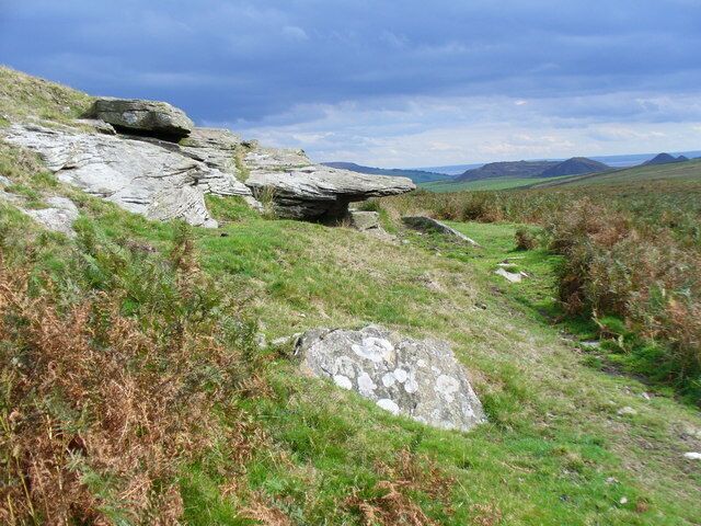Mynydd Eglwysilan, South Side of Summit. Tors outcrop on the south of this rolling grassy summit by the Rhymney Valley. In the distance are coal bings and England, across the Severn Estuary.
