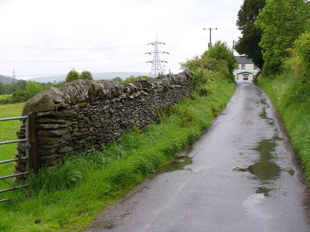 Country Lane, Llanfabon Lined by a drystone dyke, this is one of five lanes converging on the hilltop where there are a church and inn.