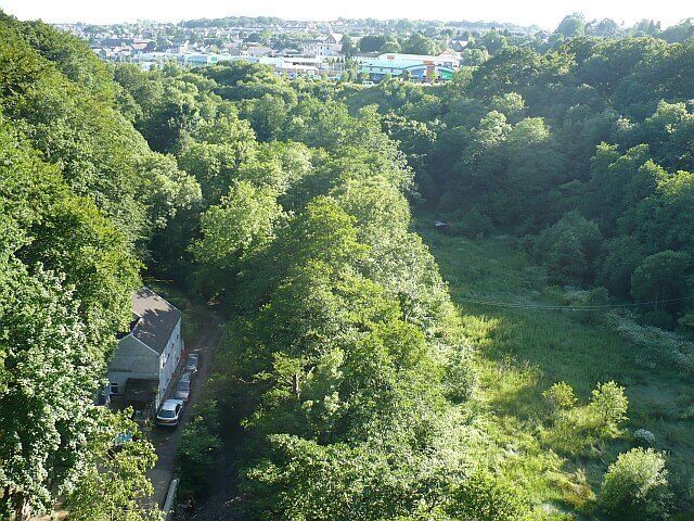 Sirhowy Valley. The view looking south from 601707. The roadway at the bottom left is part of the Sirhowy Valley Walk long distance footpath. The Sirhowy River is hidden in the trees to the right. Blackwood can be seen in the distance.