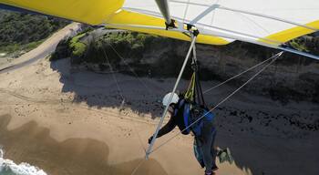 Getting ready for landing after a long flight! What's better than flying like a bird in the sky? Don't worry if you have never hang glide before. A professional glider will be controlling the glide and all you have to do is to run at full speed, jump off the cliff