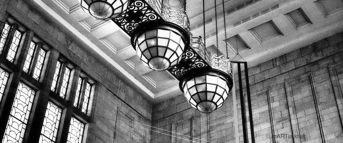 A grand interior with ornate hanging lamps and a domed ceiling.
