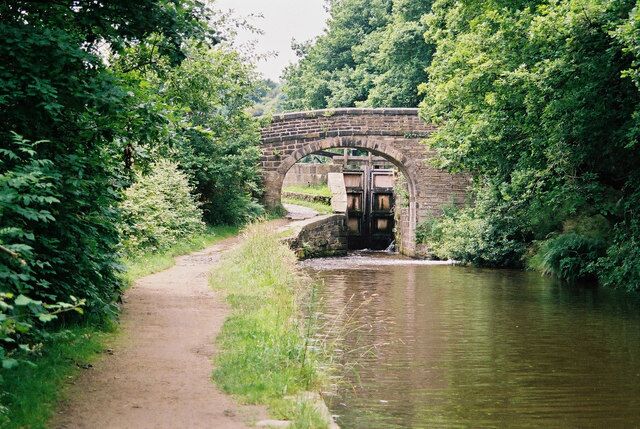 Lock No 15E, Huddersfield Narrow Canal According to one source, the bridge is called Scarwood Bridge; another has it as Appleyard Bridge. It carries a footpath which is part of the Colne Valley Circular Walk. The lock seems to be called Golcar Brook Lock, which makes sense, as the eponymous brook enters the canal here on the right hand side.