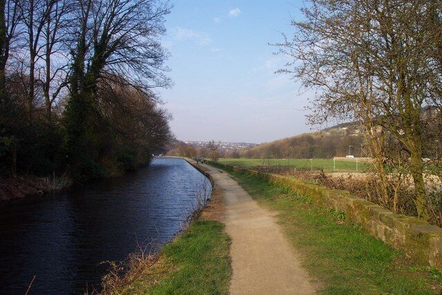 Huddersfield Narrow Canal The recently restored Huddersfield Narrow Canal, in the bottom of the Colne Valley between Linthwaite and Wellhouse. The photograph is taken from the canal bridge on the lane linking the two villages, and is looking down the valley towards Huddersfield.
