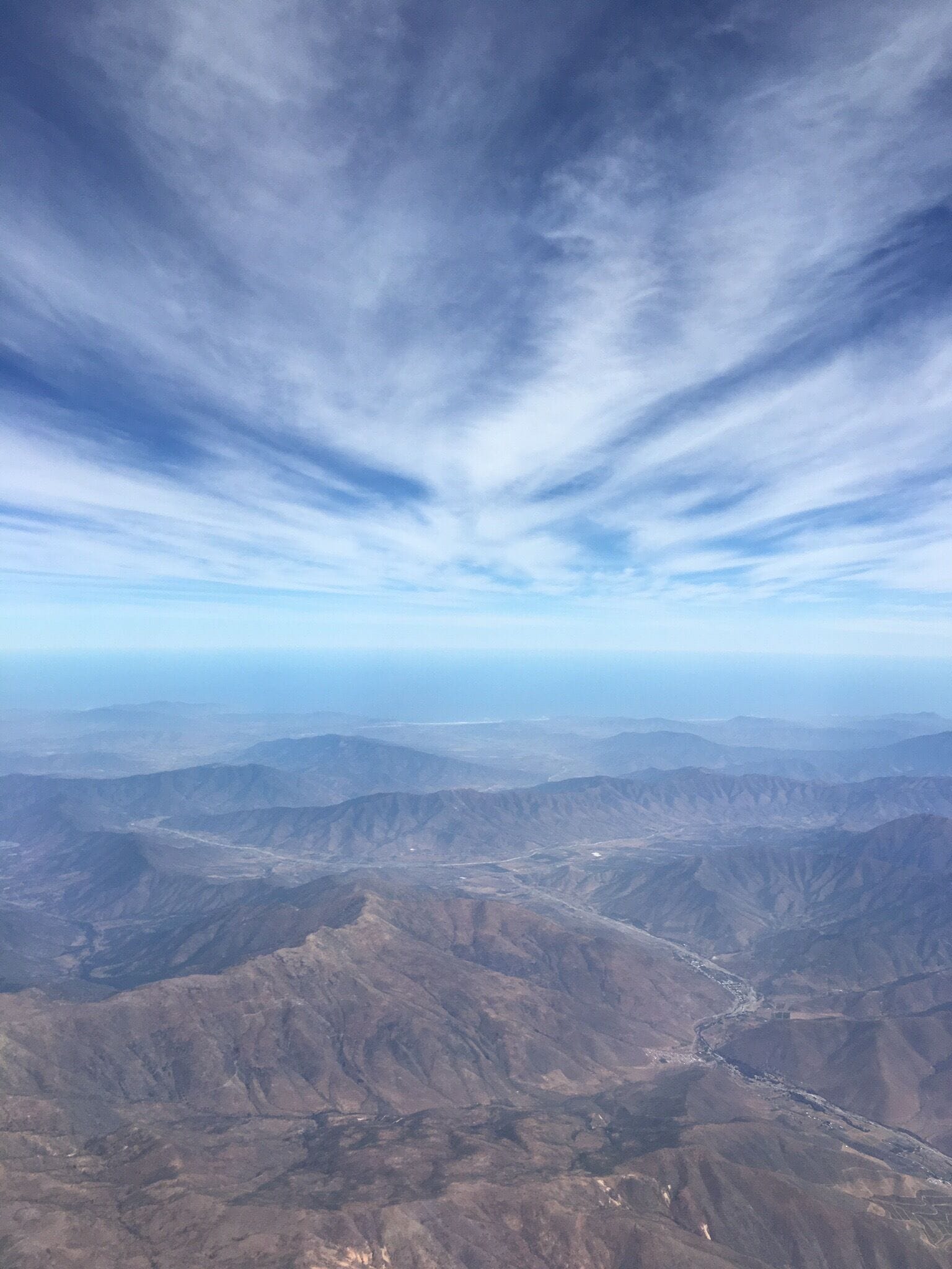 A mountainous landscape with a clear sky.