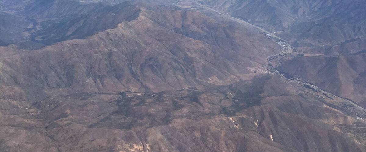 A mountainous landscape with a clear sky.