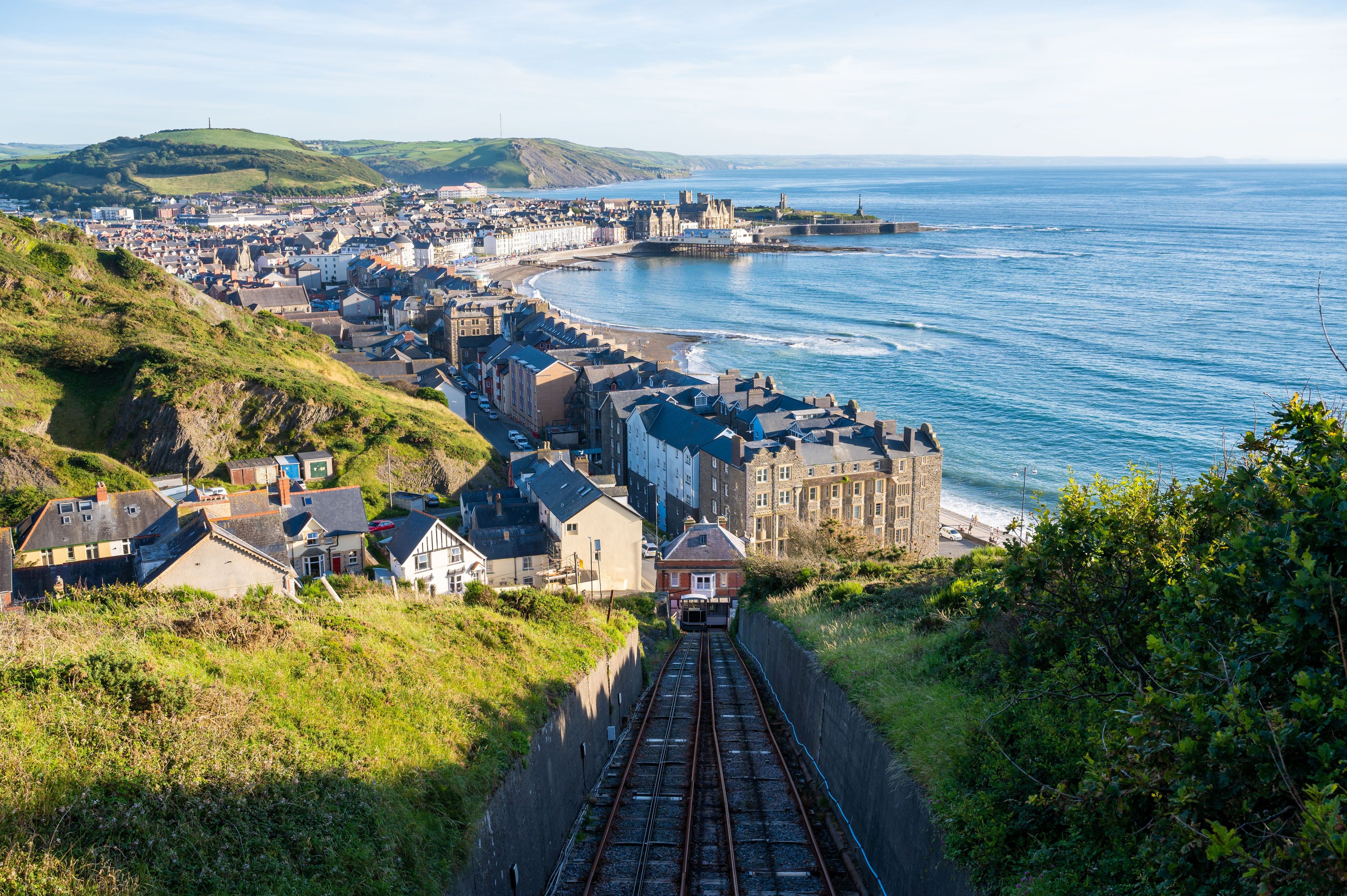 Railroad taking to Aberystwyth town of Wales with a view of the sea