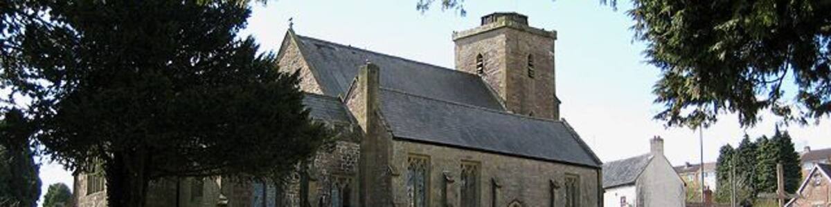 Church of St. Ethelbert, Littledean This once had a spire, but following a gale, it became unsafe and was removed in 1894. The clock on the tower is peculiar in that it bears no number 11. Roman numerals were used and IX appears twice instead of IX and XI. To the right of the picture, Littledean CE Primary School can just be seen.