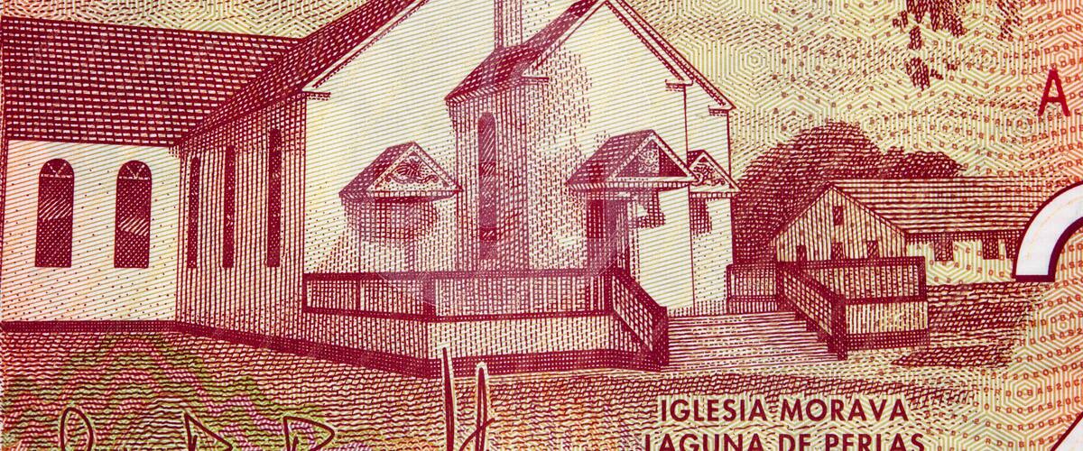 A church with a bell tower and a nearby building, surrounded by patterned designs.