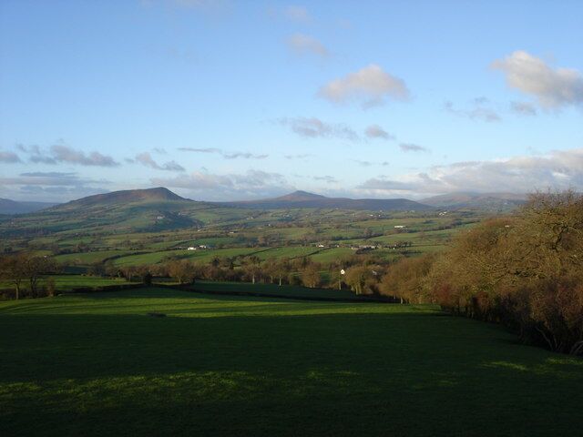 Morning sun on Ysgyryd Fawr and Sugarloaf View from the Cross Ash to Llanvihangel Crucorney road near Grosmont Wood Farm.