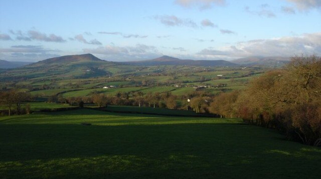 Morning sun on Ysgyryd Fawr and Sugarloaf View from the Cross Ash to Llanvihangel Crucorney road near Grosmont Wood Farm.