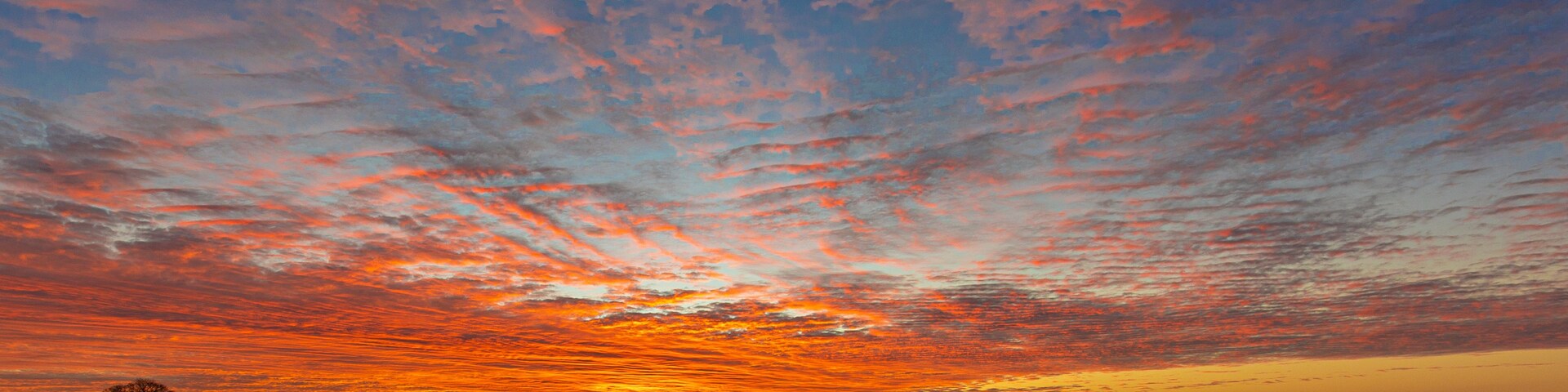 Vivid sunrise across the flat Fenlands of Lincolnshire, UK