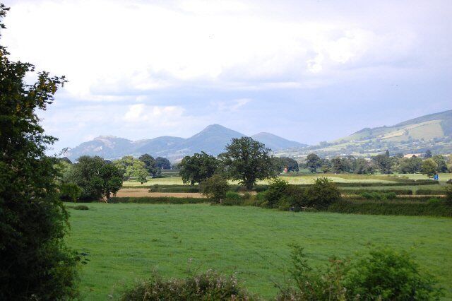 Hills in the distance and Rodneys Pillar. Lord Rodneys Monument is on the top of one of these hills. Lord Rodney was an Admiral and the monument was built by the gentlemen of Montgomeryshire who supplied oak from the area & shipped them down the river Severn to Bristol where Admiral Rodney's fleet was built.