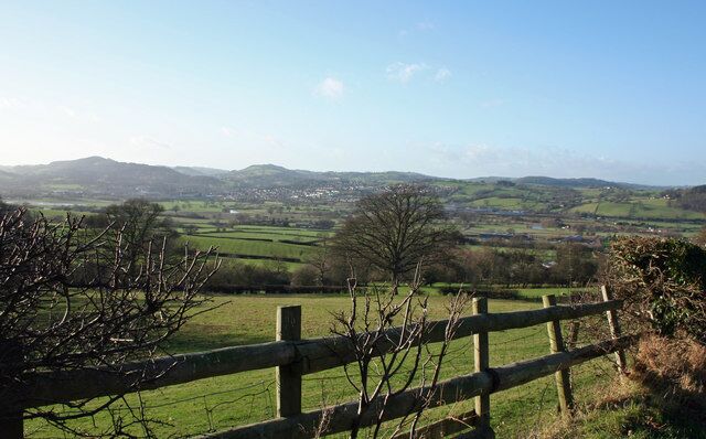 On The Horizon View of Welshpool from minor road beneath Oak Plantation.