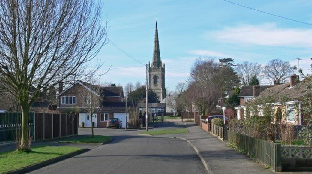 St Peters Avenue, Witherley, Leicestershire, with the 15th-century tower and spire of St Peter's parish church in the background