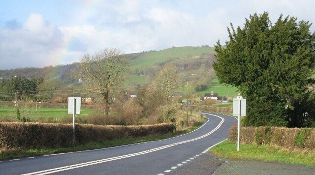 The A458 At the junction with the B4395 between Llangadfan and Foel. A partial rainbow rises from the left of the photograph.