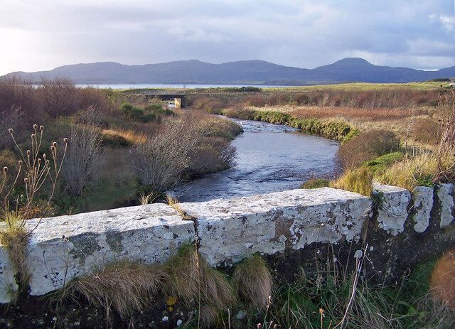 New bridge from the old The old and narrow stone bridge is now unused. The new bridge carries the A863 over the River Ose.