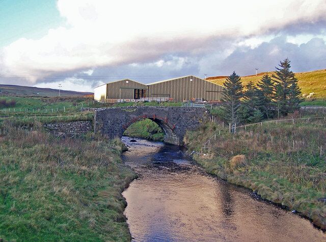 Old bridge at Caroy. Contrast this picture with this one by John Allan - 107403. The bridge is the same, but the huge barns behind it are new.