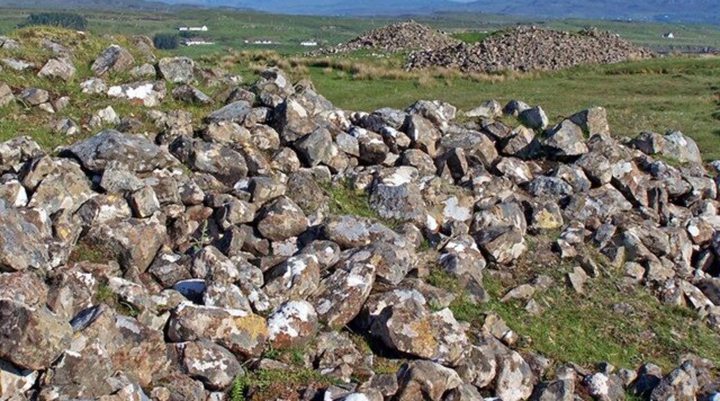 Barpannan chambered cairns (2). See full description here - 1335101 . The size of these neolithic cairns can only be fully appreciated when you get up close. There are no signposts or information at the site, so the majority of visitors to Skye drive past on the main road to Dunvegan without even noticing them. In this view, the Black Cuillin form the background.