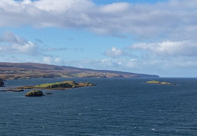 Islands in Loch Dunvegan Viewed from a high point just south of Uiginish Point, looking north west towards the Duirinish peninsula which ends at Dunvegan Head. The islands are (closest) Stac na Bearta (mostly in square NG2348), beyond it is Garay Island, and on the right Eilean Grianal.