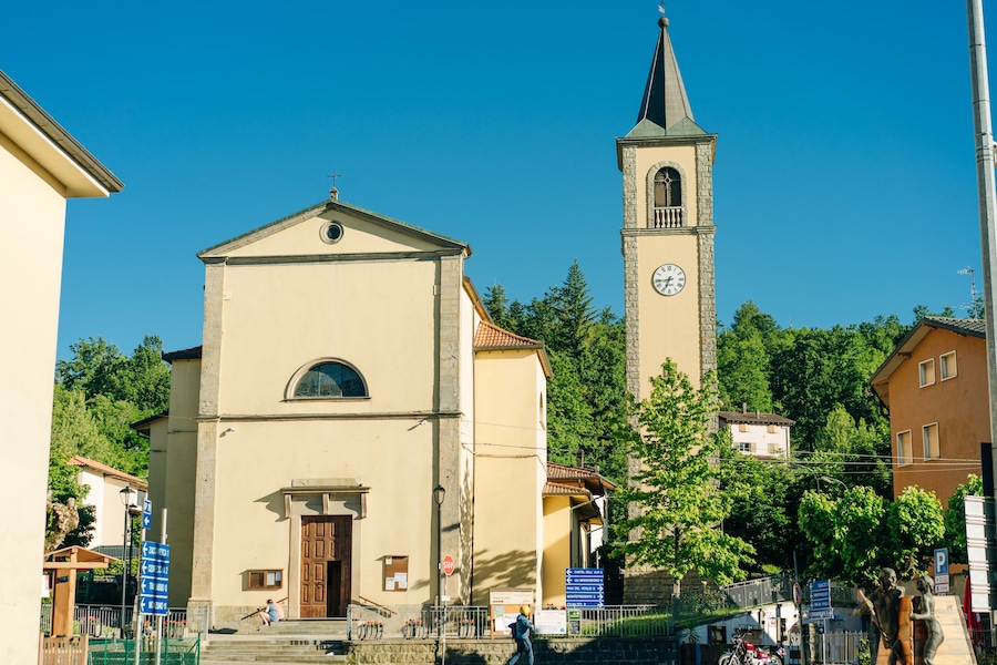Sentiero degli Dei. Village and wind wind turbine along the Path of the Gods. San Benedetto val di Sambro, Bologna Province, Emilia Romagna, Italy.