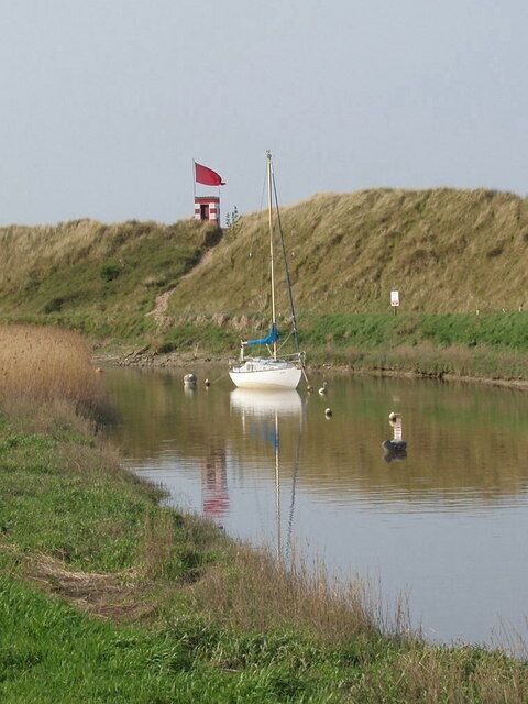 Firing range danger flag by Alt estuary View from Hightown across the Alt to the earth bank at the edge of Altcar ranges.