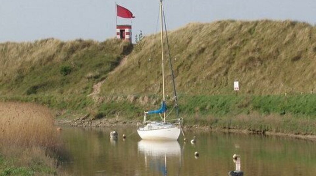 Firing range danger flag by Alt estuary View from Hightown across the Alt to the earth bank at the edge of Altcar ranges.