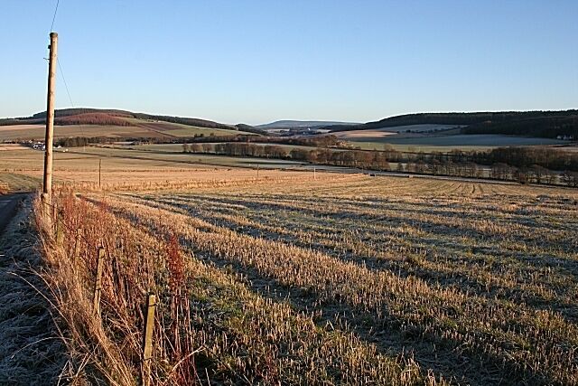 The View from Balnabreich Looking down from the slightly elevated farm of Balnabreich towards Mulben. The skyline at left of the Hill of Muldearie, and Meikle Balloch is further away.