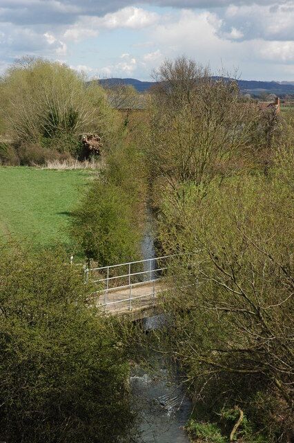 Carrant Brook, near Northway Mill The Carrant Brook near Northway Mill, viewed from a bridge over the M5 motorway.
