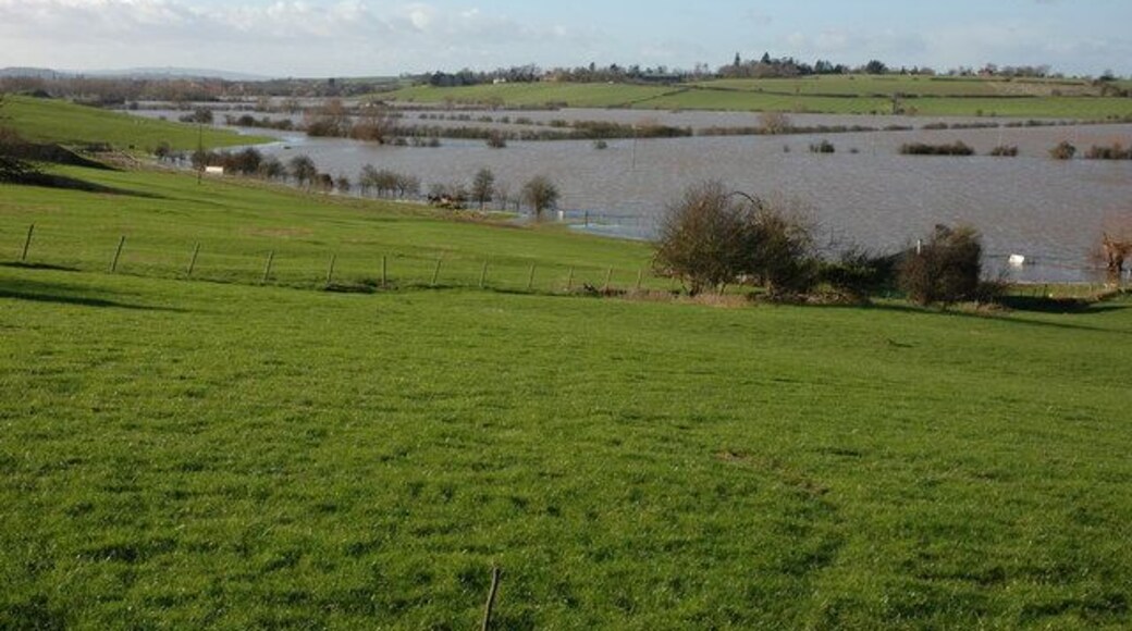 Flooded Avon north of Tewkesbury View down the flooded Avon valley towards Tewkesbury, the high ground on the opposite side is the Mythe Hill. On the horizon to the left is May Hill with its distinctive clump of trees on the summit.