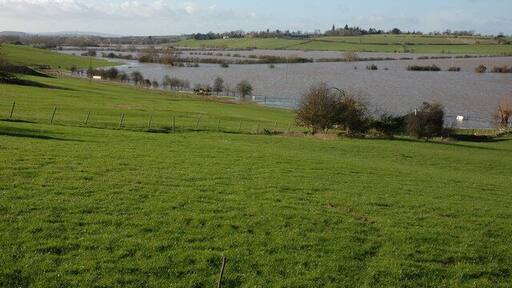 Flooded Avon north of Tewkesbury View down the flooded Avon valley towards Tewkesbury, the high ground on the opposite side is the Mythe Hill. On the horizon to the left is May Hill with its distinctive clump of trees on the summit.