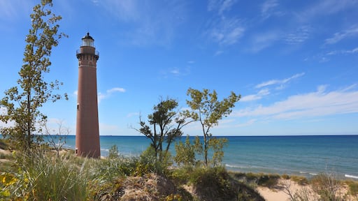 Red brick Little Sable Point lighthouse in Silver Lake Park Michigan; Shutterstock ID 323913845