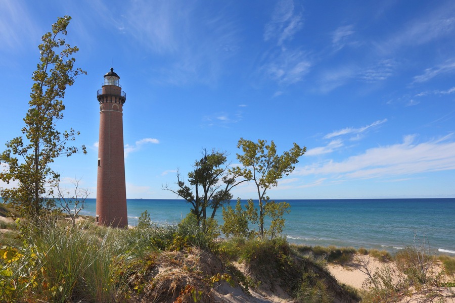 Red brick Little Sable Point lighthouse in Silver Lake Park Michigan; Shutterstock ID 323913845