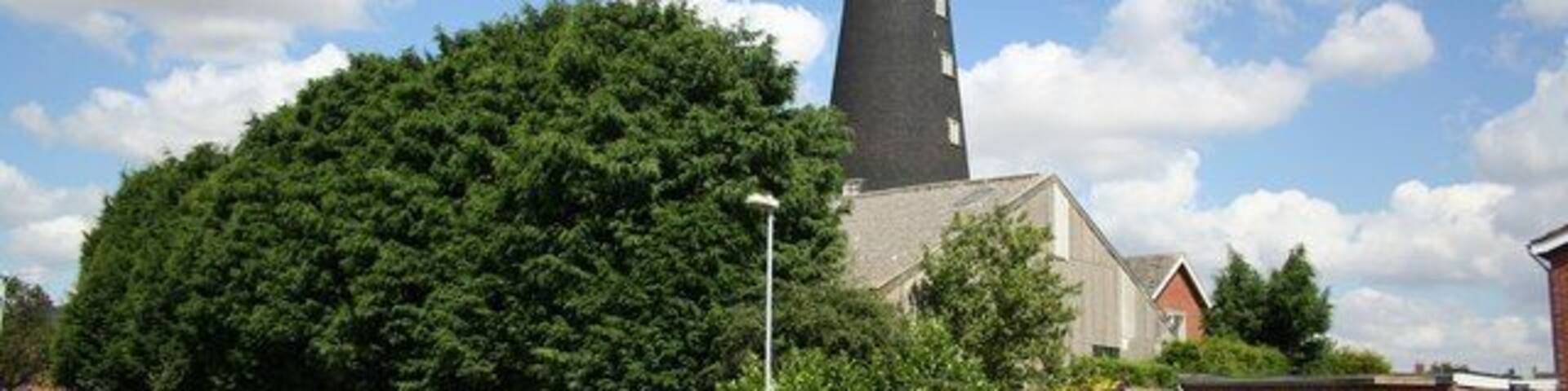 Wragby Mill Six storey tower mill built in 1831, now surrounded by modern housing. Its 6 sails worked until 1906 and milled by oil engine power for some time afterwards.