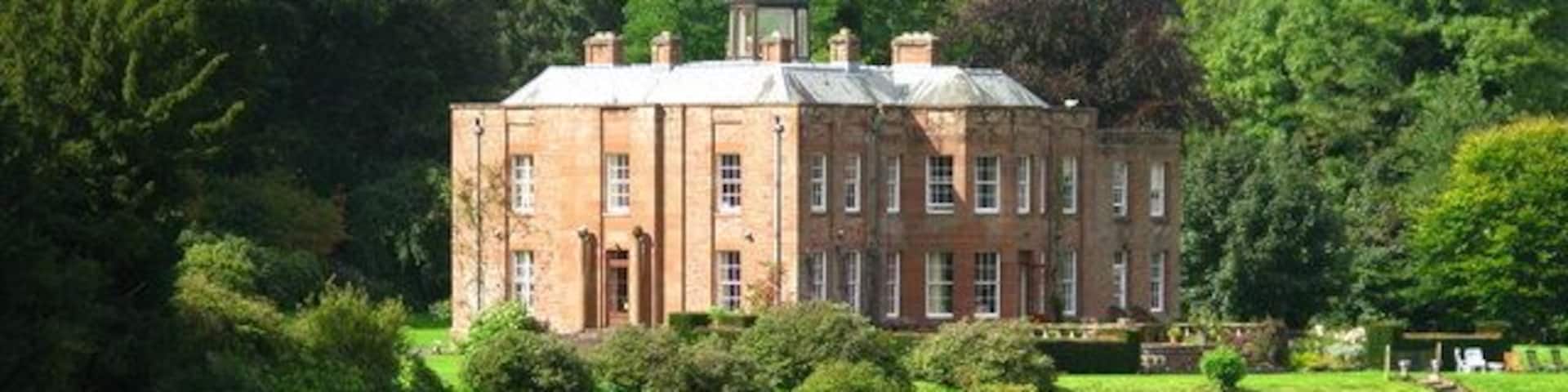 Warwick Hall Warwick Hall was once owned by the Liddle family. It is a 20th century building done in the neo-Georgian style. An 1828 building once occupied the site but burned down in 1936. The stables at the hall are original Georgian.