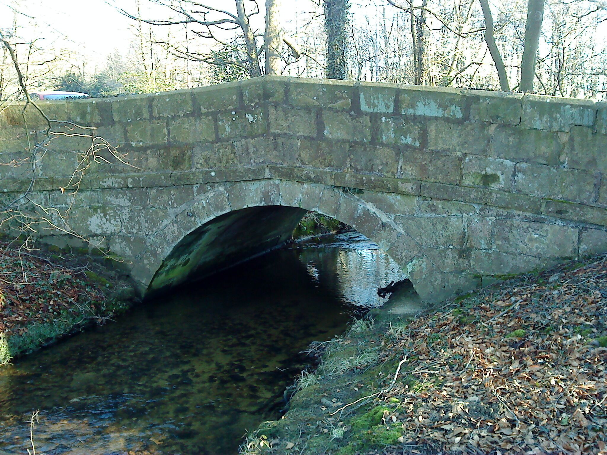 Hungate Bridge. Grade II bridge over Hungate Dike: single round arch, band and coped parapet. Late 18th C. built by Lord Grantley.